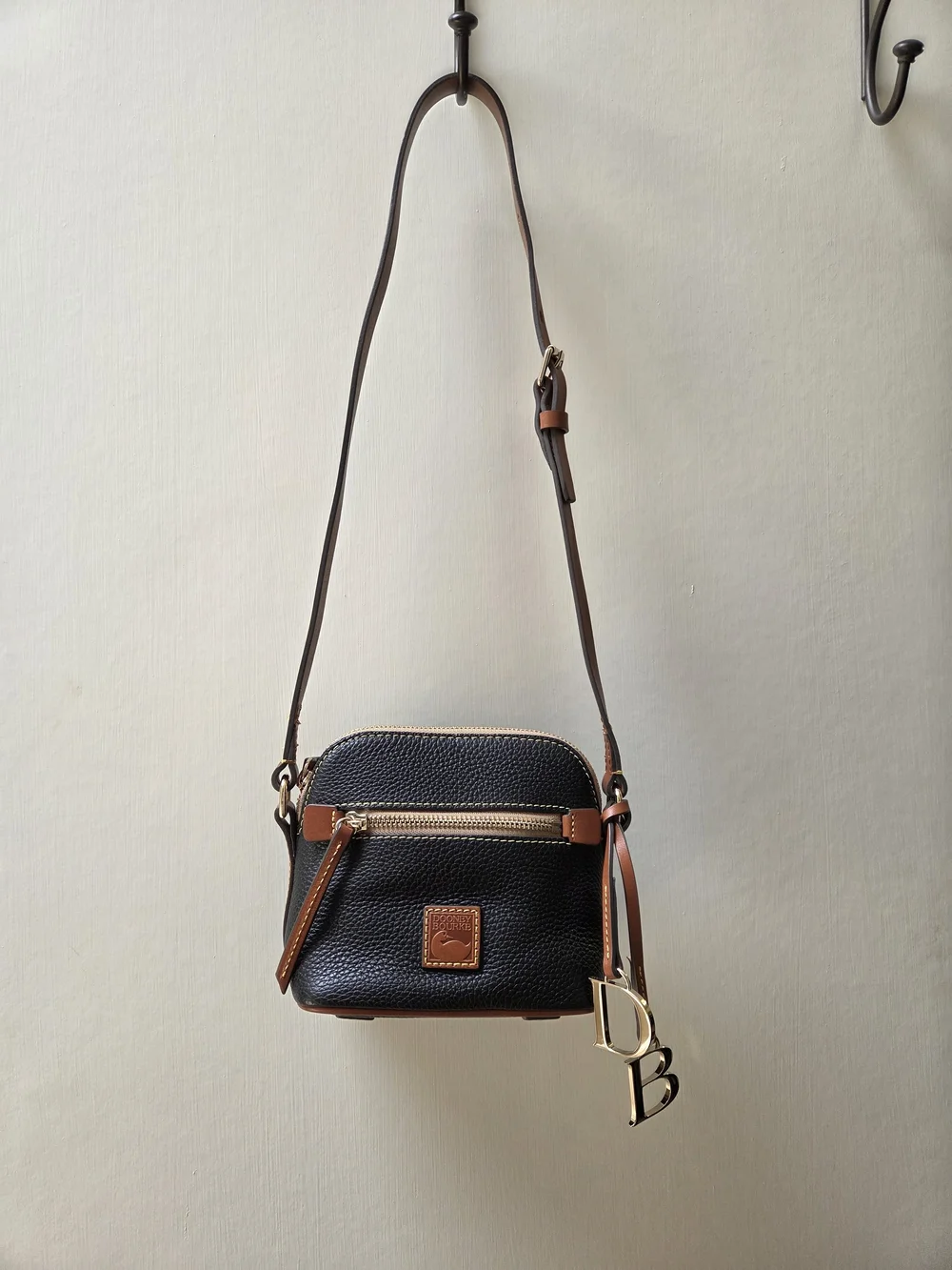 Dooney & Bourke NWT Black Pebble Leather Crossbody with Brown Trim. Logo charms